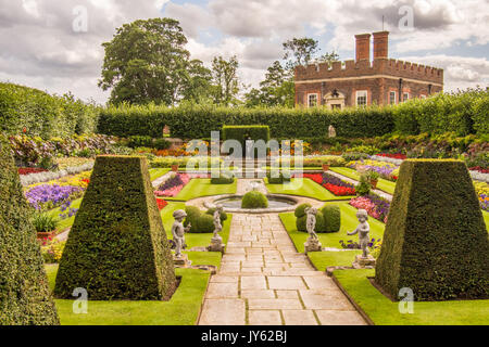 One of many gardens at Hampton Court. William III's Banqueting House is in the background, Richmond upon Thames, London. Stock Photo