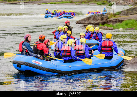 Byglandsfjord, Norway - August 1, 2017: Travel documentary of rafting group just after an adventure on the river. Smiling faces and a calm moment befo Stock Photo