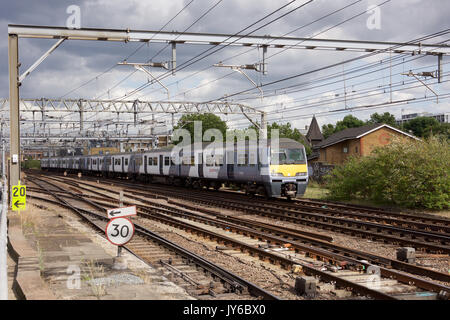 Greater Anglia Electric Multiple Unit train passing Bethnal Green in London Stock Photo