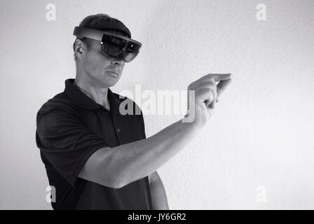 engineer working with smart glasses creating virtual reality Stock Photo