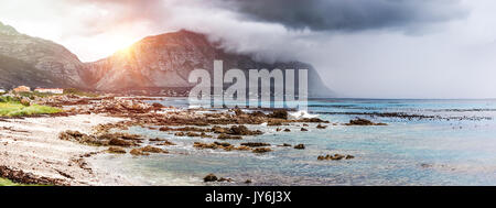 Beautiful landscape of Betty's Bay, mountains in the fog near seashore, amazing panoramic view, beauty of wild nature, Atlantic Ocean, South Africa Stock Photo