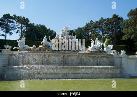 VIENNA, AUSTRIA - APR 30th, 2017: Neptune Fountain Neptunbrunnen in great parterre of Schoenbrunn public park, Schoenbrunn palace - former imperial summer residence, built and remodelled during reign of Empress Maria Theresa in 1743 Stock Photo
