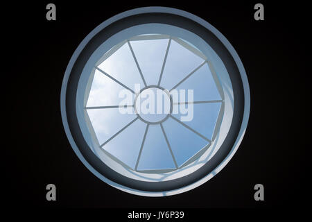 circular skylight on ceiling with blue sky Stock Photo
