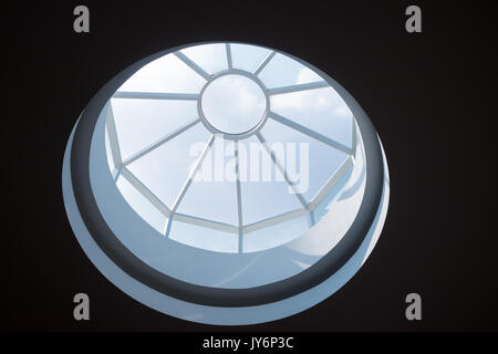 circular skylight on ceiling with blue sky Stock Photo