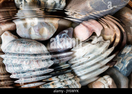 Water ripples above pebble stones - digitally altered Stock Photo