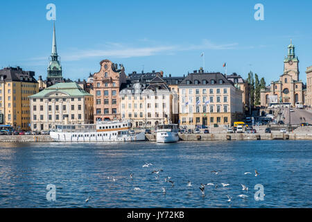 View towards historic Old Town from Skeppsholmen bridge  in Stockholm. The capital city of Sweden is built on 17 islands. Stock Photo