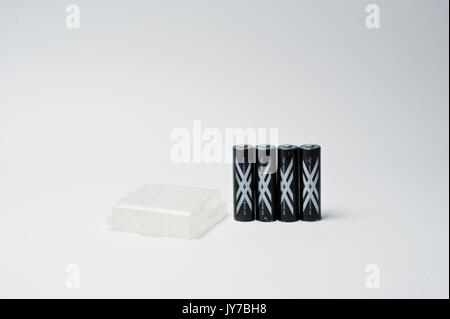 Hai, Ukraine - August 10, 2017: close-up photo of four black batteries on white background. Stock Photo