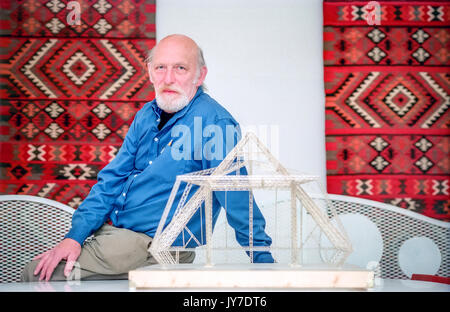 Designer Bill Harkin, designer of the Glastonbury Festival's Pyramid Stage, with the original scale model he made. Stock Photo