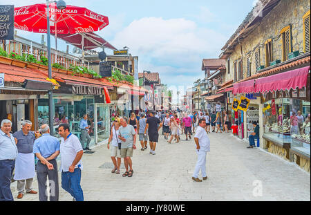SIDE, TURKEY - MAY 8, 2017: People walk along Liman cadessi - main shopping street with interesting stores, local craft souvenirs and tasty Eastern sw Stock Photo
