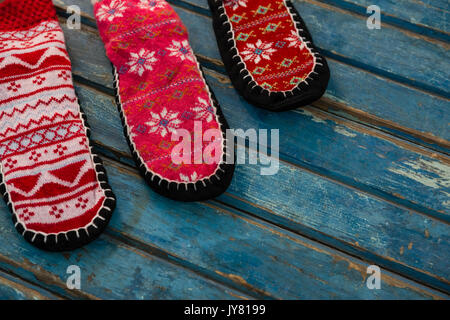 Close up of woolen socks on wooden table Stock Photo