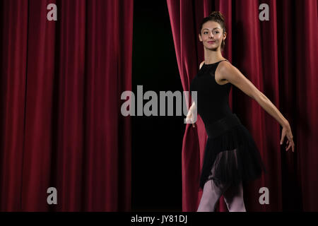 Ballerina performing ballet dance on stage in theatre Stock Photo
