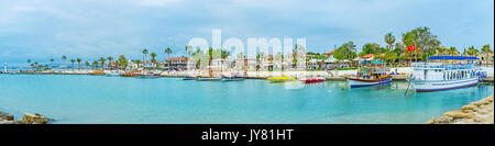 SIDE, TURKEY - MAY 8, 2017: Panorama of Mediterranean resort with boats and yachts in port, lovely cafes, restaurants and tourist stores along the sea Stock Photo