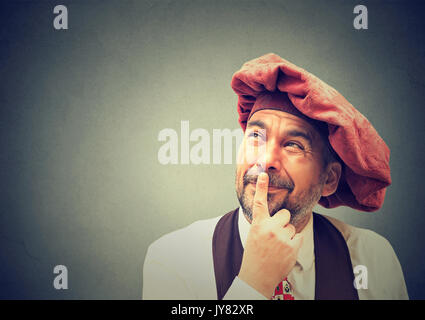 Portrait of a thoughtful mature man looking up Stock Photo