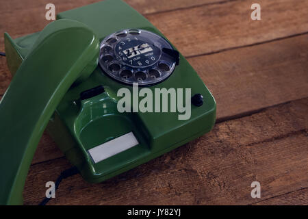 Close-up of vintage phone on wooden table Stock Photo