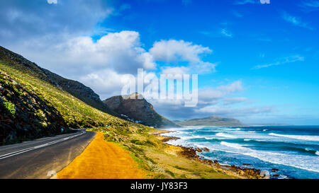 The Atlantic coast along the road to Chapman's Peak at the Slangkop Lighthouse near the village of Het Kommetjie in the Cape Peninsula of South Africa Stock Photo