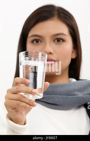 malay woman holding a glass of water Stock Photo