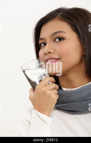 malay woman holding a glass of water Stock Photo