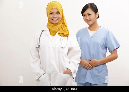 asian nurse and doctor on the white background Stock Photo