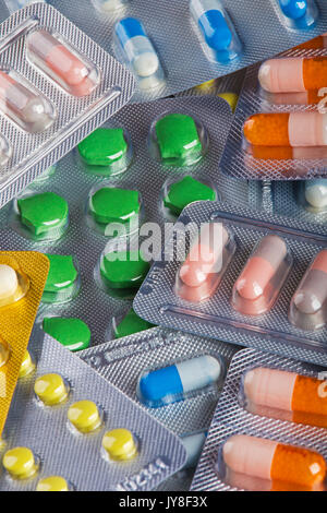 Background collage of colorful pills and capsules of modern medicine. A concept to show advancement in modern medicine Stock Photo