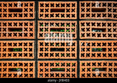 Red Brick patterns with cross and square on block Stock Photo