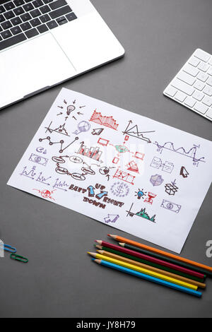 Creative sketch in spiral notepad with laptop on desk. Business idea concept Stock Photo