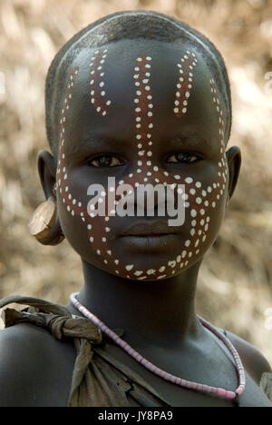 Young Girl with face painted, Mursi Tribe, Mago National Park, Lower Omo Valley, Ethiopia, portrait, person, one, tribes, tribal, indigenous, peoples, Stock Photo