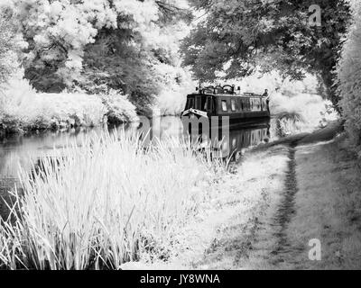 A narrowboat on the Kennet and Avon Canal in Wiltshire shot in infrared.