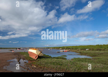 An early evening scene of boats moored at Burnham Overy Staithe on the north Norfolk coast in early June. Stock Photo