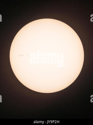 Photograph of the midday sun showing sunspots; cooler regions of the sun, San Luis Valley, Central Colorado, USA Stock Photo
