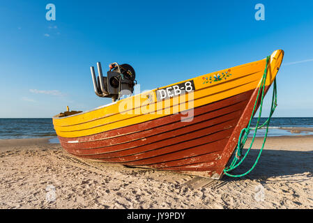 DEBKI, POLAND, AUGUST 15, 2017: Traditional fishing boat on sandy beach in Debki village, Baltic Sea, Poland. Stock Photo