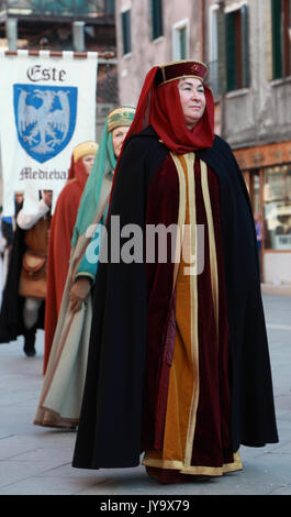 Venice,Italy-February 26th, 2011:  A medieval woman marching in a costume parade in Venice during The Carnival days.The Carnival of Venice (Carnevale  Stock Photo