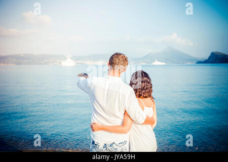 https://l450v.alamy.com/450v/jya59h/back-view-couple-hug-on-boat-marine-background-jya59h.jpg