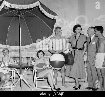Dr Maurice Sullivan (second from right), guest, and cast on set for 'Beware of the Sun' segment of the Johns Hopkins Science Review television show, May, 1951. Stock Photo