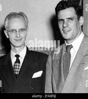 American television host Lynn Poole (left) standing with producer and director of the Johns Hopkins Science Review television show, Anthony Farrar (right), 1951. Stock Photo