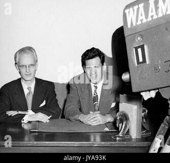 American television host Lynn Poole (left) on set of the Johns Hopkins Science Review television program with producer and director Anthony Farrar (right), 1951. Stock Photo