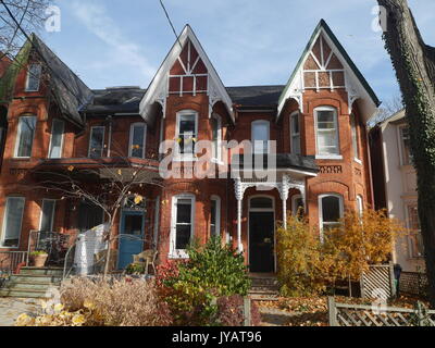 Victorian row of houses with gable roofs Stock Photo - Alamy