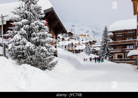 Tourists in the alpine village surrounded by snow and woods Bettmeralp district of Raron canton of Valais Switzerland Europe Stock Photo
