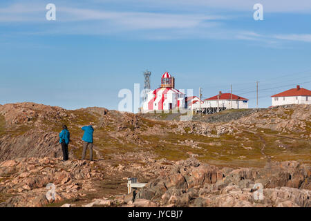 Tourists visiting the Cape Bonavista Lighthouse that is perched atop a rocky landscape in Bonavista,, Newfoundland and Labrador, Canada. Stock Photo