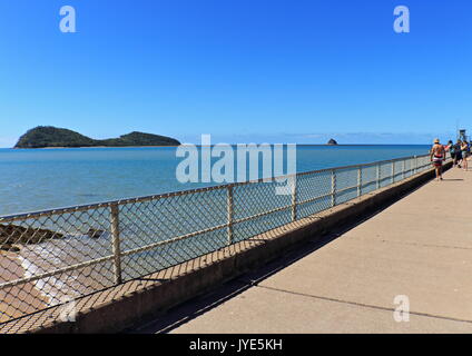 The wide angle shot of the beach, the island views, and the jetty at beautiful Palm Cove on a perfect winter's day in the tropics Stock Photo