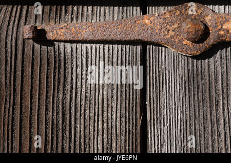 Rusty metal fastening on large wooden boards, texture, horizontal colored photo Stock Photo