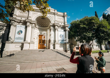 Tbilisi, Georgia - October 29, 2016: Tourists From China Taking Photo Georgian National Gallery Built Based On Resolution From Russian Tsar In 1888. N Stock Photo