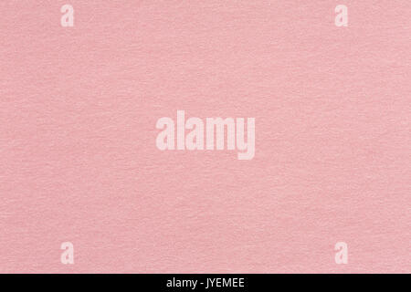 Recycled craft paper textured background in light pink old rose color tone: Detailed texture of recycled kraft paper fiber in pastel toned style. High Stock Photo