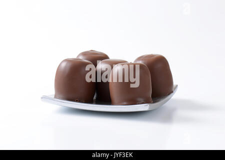 Marshmallows coated in milk chocolate Stock Photo