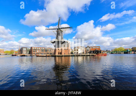 View of Windmill De Adriaan reflected in the canal of the river Spaarne Haarlem North Holland The Netherlands Europe Stock Photo