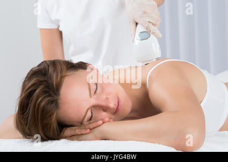 Young Beautiful Woman Getting Epilation Laser Treatment Stock Photo