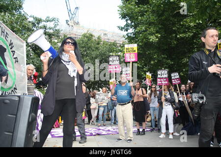 London, UK, 19th August 2017. Maz Saleem from Stand Up To Trump and demonstrators  protest against Donald Trump's recent statements against Korea and about events in Charlottesville takes place outside the US embassy in London. Roland Ravenhill/Alamy Live News. Stock Photo