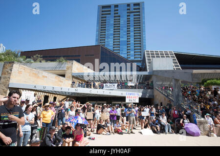 Austin, Texas, USA. 19th Aug, 2017. Activists and protesters converge on City Hall for a hot two-hour rally against racism and President Donald Trump's apparent insensitive comments about recent Charlottesville violence that left one dead. About 1,000 gathered in Saturday's Texas heat. Credit: Bob Daemmrich/Alamy Live News Stock Photo