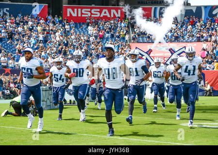 Tennessee Titans tackle Taylor Lewan (77) shakes hands with military  veterans during halftime at NFL football game between the Titans and the  Cincinnati Bengals Sunday, Nov. 12, 2017, in Nashville, Tenn. (AP