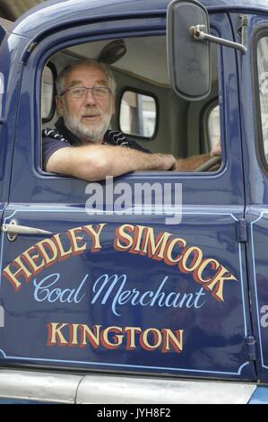 Kington, , UK. 20th Aug, 2017. The Herefordshire market town of Kington came to a standstill while a parade of vintage vehicles made their way to the Kington Vintage Club's 25th Annual Show. A smile from a driver of a vintage Bedford Hedley Simcock coal lorry. Credit: Andrew Compton/Alamy Live News Stock Photo