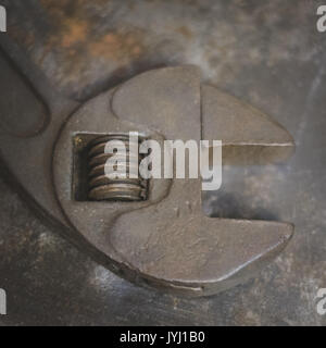 vintage pliers , old tongs isolated on industrial background Stock Photo